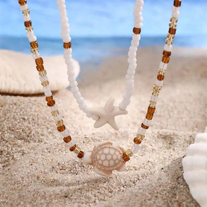 Collier perles tortue étoile de mer ras du cou vintage plage femme